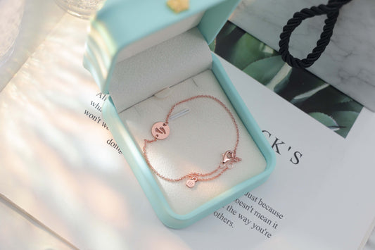Round rose-gold footprint bracelet — personalized baby memory jewelry.