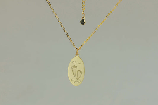 Oval Dario Necklace with engraved baby footprints, name, and birthdate – custom keepsake jewelry made by Chapters of Joy.