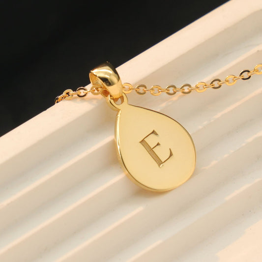 Custom drop shape pendant engraved with a loved one’s  initials