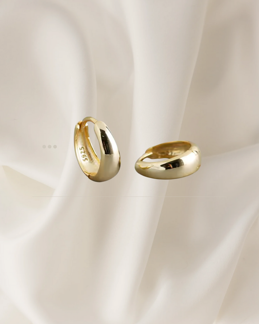 Domed gold  hoop earrings with a smooth, radiant finish — Sola Hoops by Chapters of Joy.