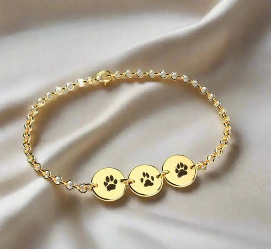 Gold plated, Sterling silver bracelet engraved with three pet paw prints — custom personalized keepsake jewelry from Chapters of Joy.