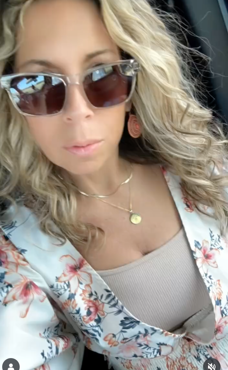 lady wearing Gold plated, sterling silver pendant necklace engraved with a pet’s paw print and name — custom  jewelry from Chapters of Joy.