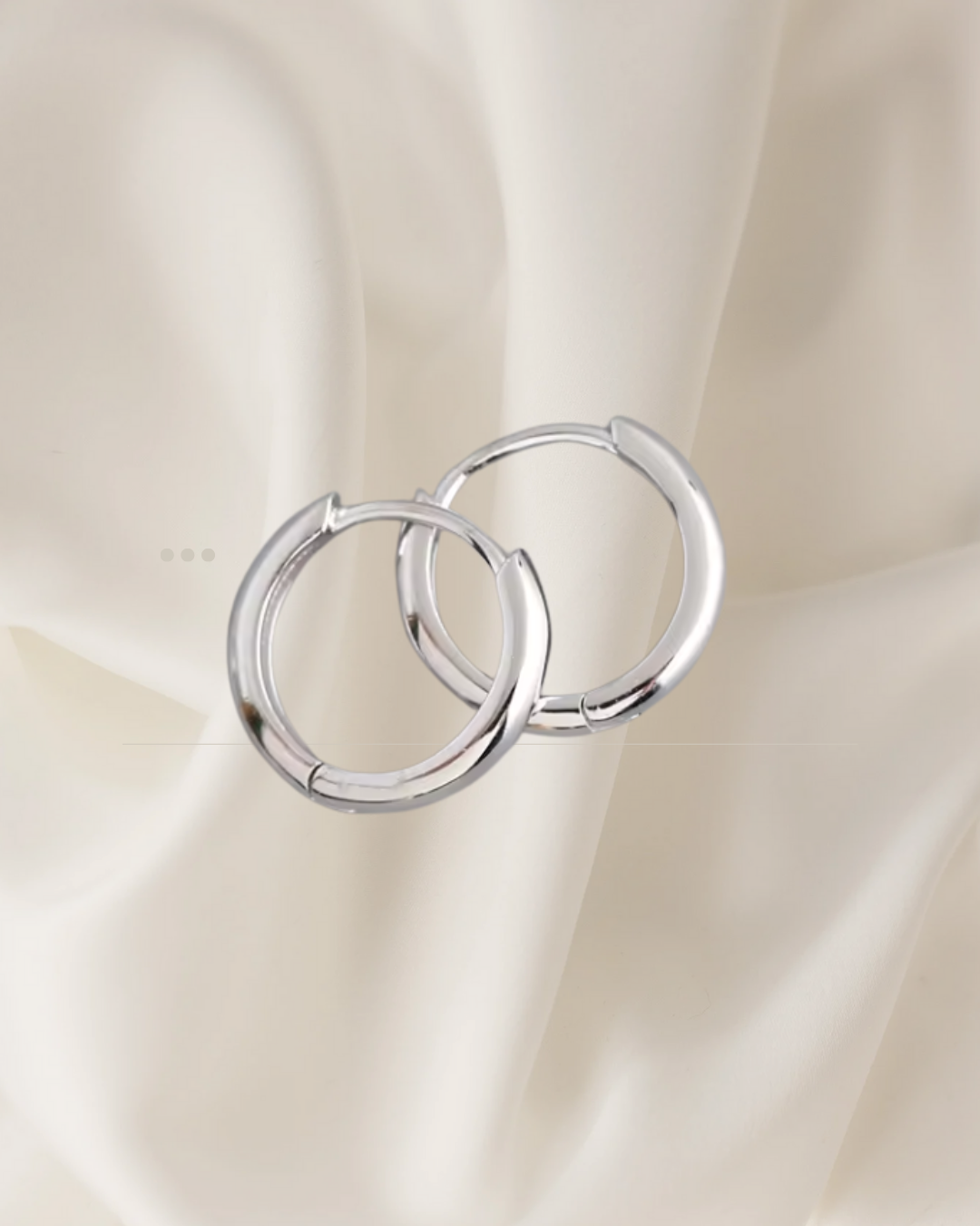 Minimalist silver, medium size hoop earrings in two sizes, designed for everyday elegance — Ena Hoops by Chapters of Joy.
