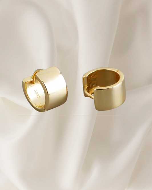 Minimalist structured gold and silver hoop earrings available in medium size — Vara Hoops by Chapters of Joy.