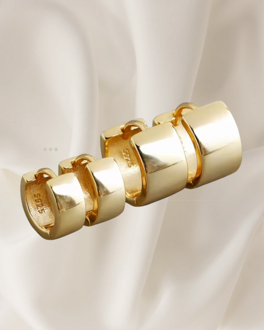 Minimalist structured gold and silver hoop earrings available in two sizes — Vara Hoops by Chapters of Joy.