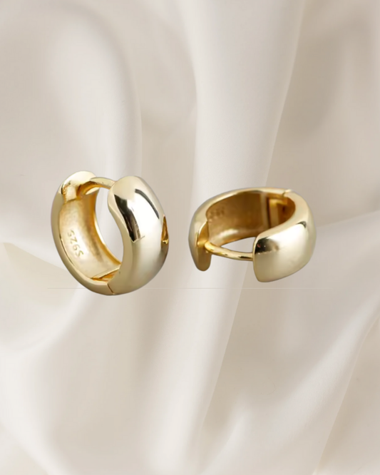 Polished gold  hoop earrings with rounded shape and timeless shine — Nora Hoops by Chapters of Joy.