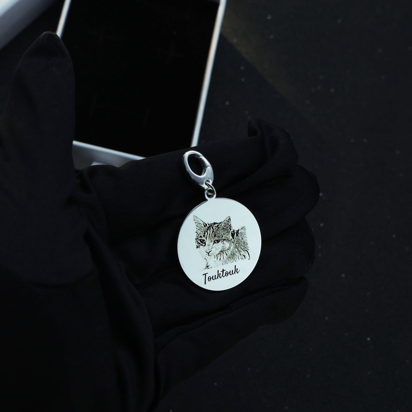 Sterling silver Duo Tag engraved with the second cat face, symbolizing the bond between beloved companions.