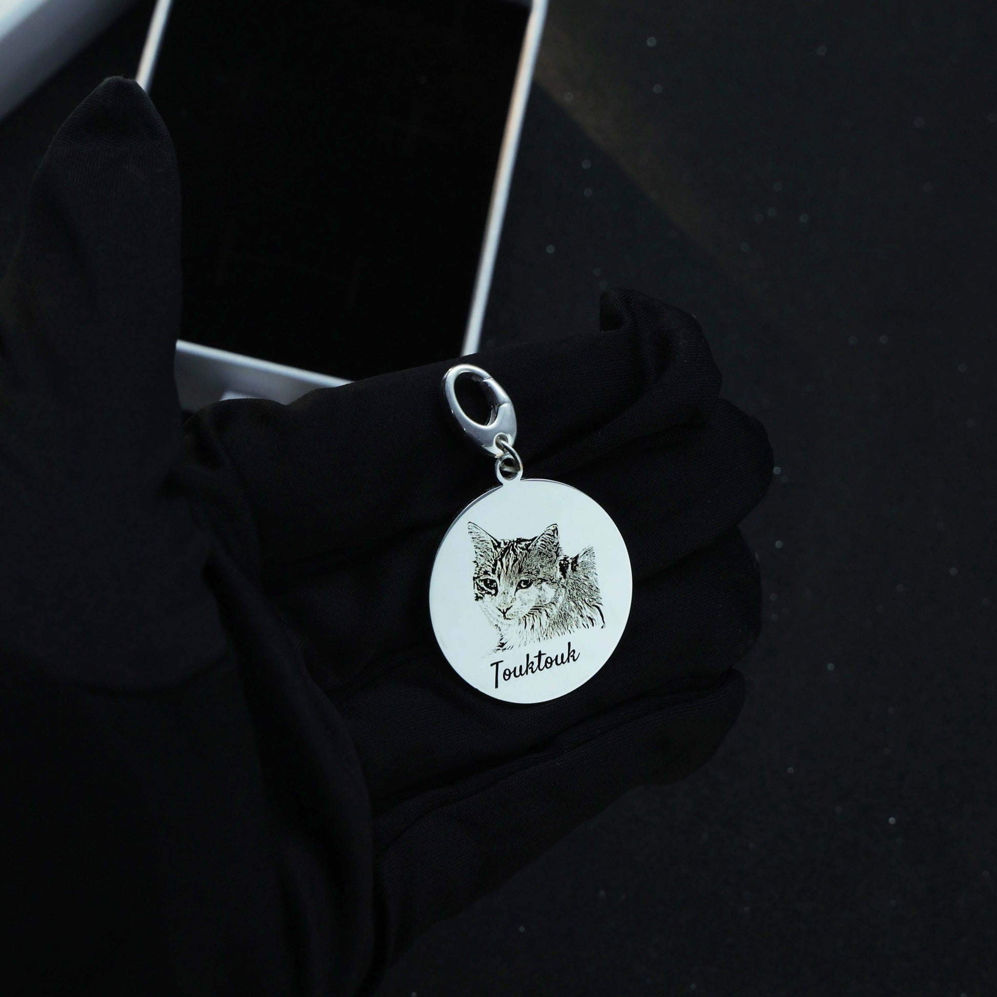 Sterling silver Duo Tag engraved with the second cat face, symbolizing the bond between beloved companions.