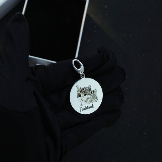 Sterling silver Duo Tag engraved with the second cat face, symbolizing the bond between beloved companions.