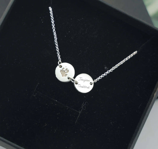 Sterling silver bracelet engraved with pet paw print and name — custom keepsake jewelry from Chapters of Joy.
