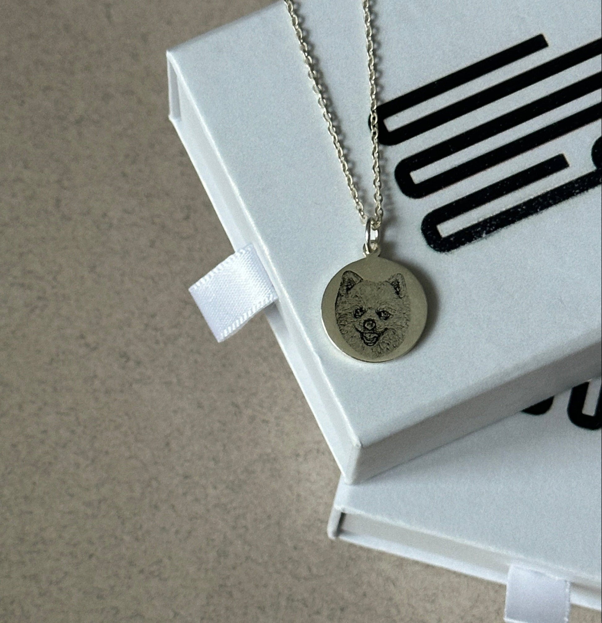 Sterling silver pendant engraved with a  portrait — custom memorial necklace.