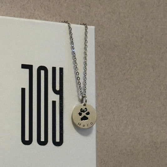 White gold–plated silver pendant engraved with a custom paw or nose print, personalized pet keepsake necklace.