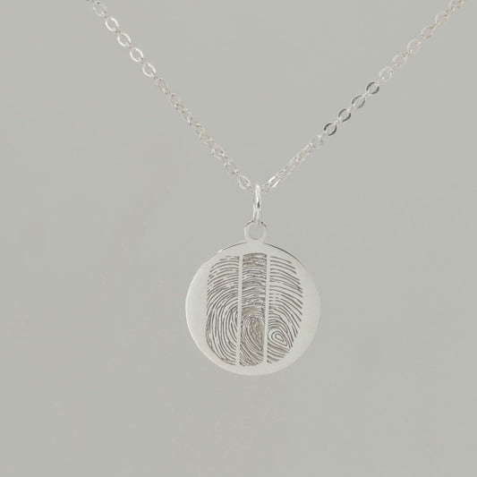 Custom engraved pendant with fingerprints and ‘Together as one’ inscription