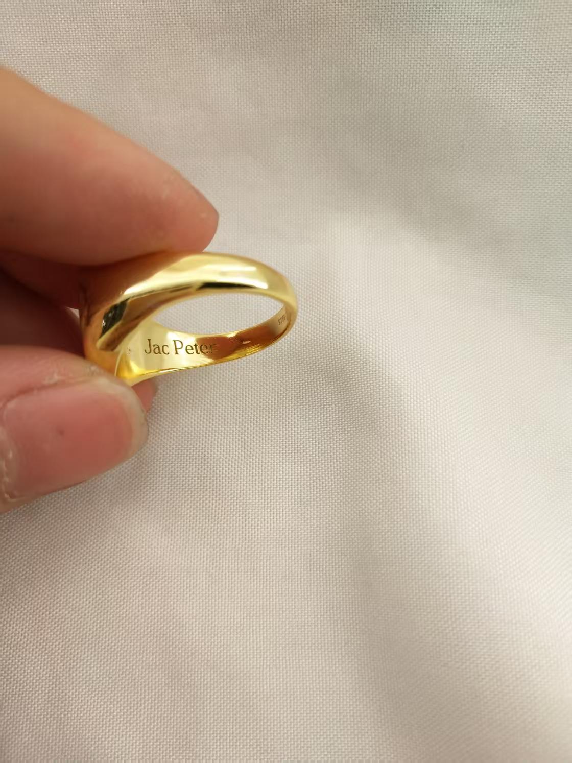 Gold plated signet ring engraved with a loved one’s handprint. inside is Jac Peter engraved
