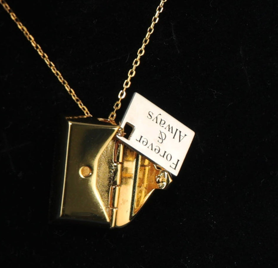 Lunelle necklace in sterling silver with hidden letter pendant.