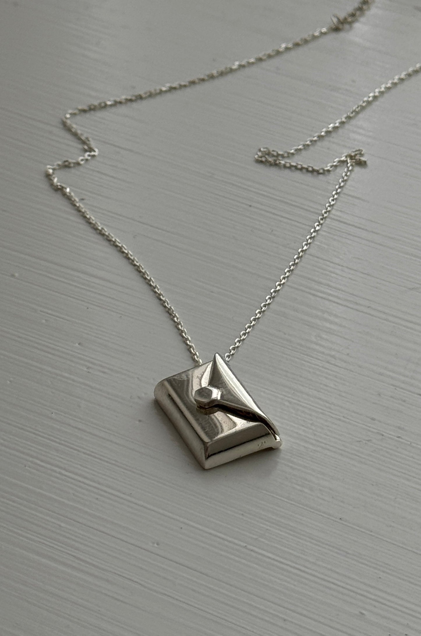 Lunelle necklace in sterling silver with hidden letter pendant