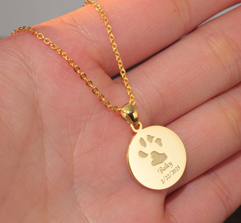 Gold plated paw print jewelry for pet lovers, handcrafted keepsake necklace.