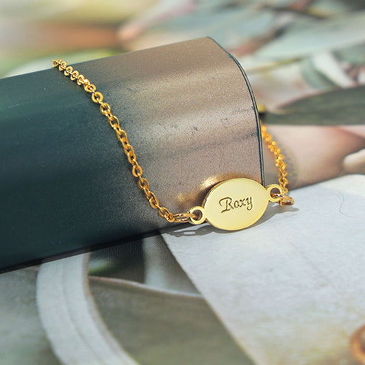 Roxy oval bracelet in sterling silver 18k gold plated with engraving names on both sides.