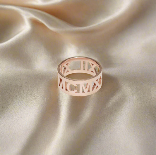 Rose Gold Plated Amora Ring engraved with Roman numerals, symbolizing love and lasting memories.