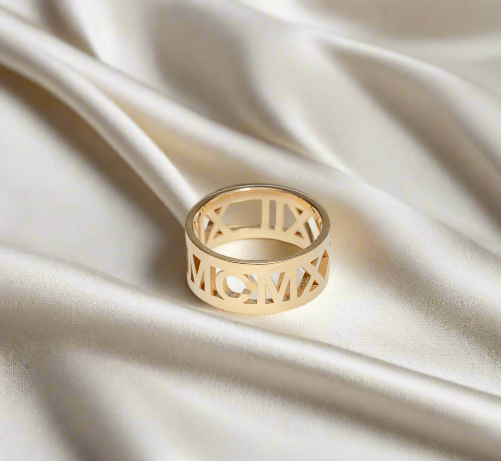 Gold plated Amora Ring engraved with Roman numerals, symbolizing love and lasting memories.