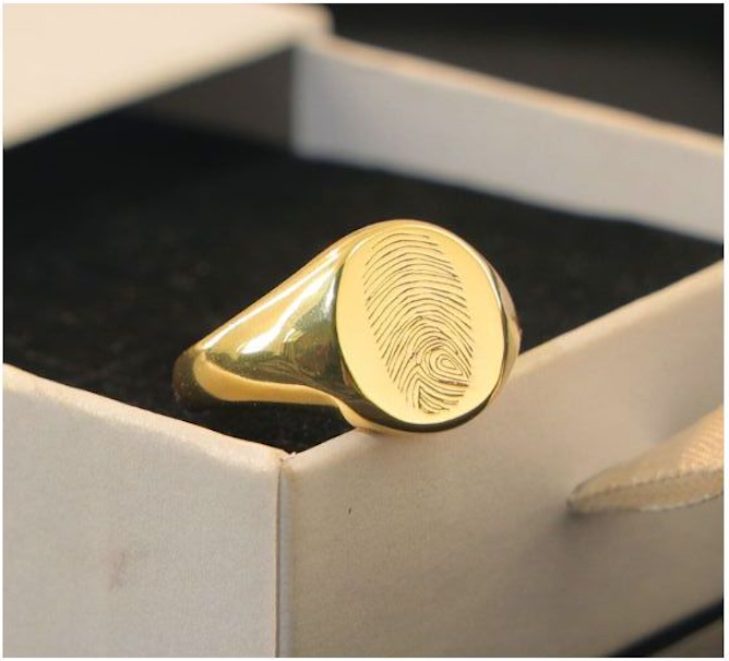 Fingerprint signet ring engraved with a loved one’s fingerprint — personalized custom jewelry from Chapters of Joy.