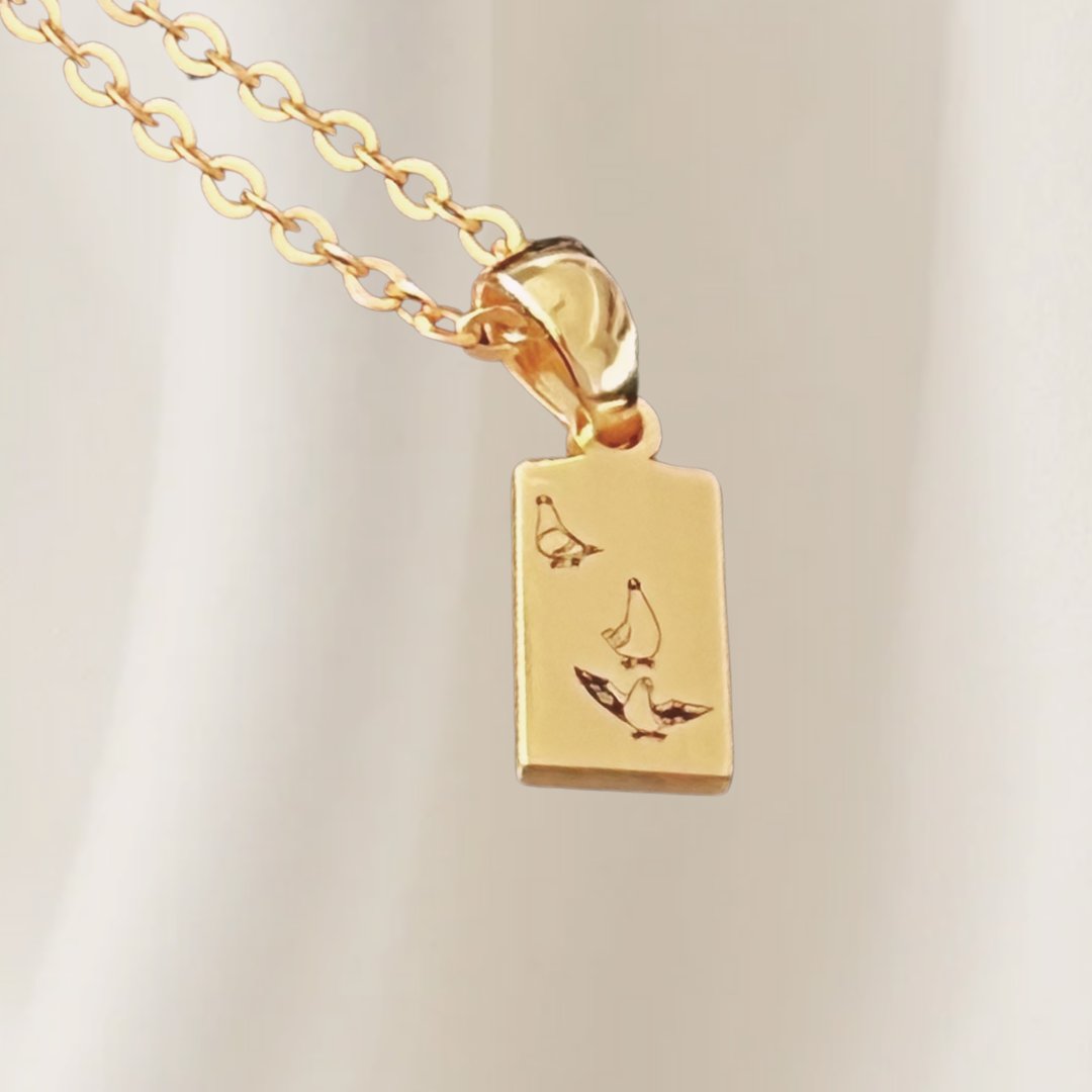 Pendant necklace engraved with a child’s drawing — personalized custom jewelry from Chapters of Joy.