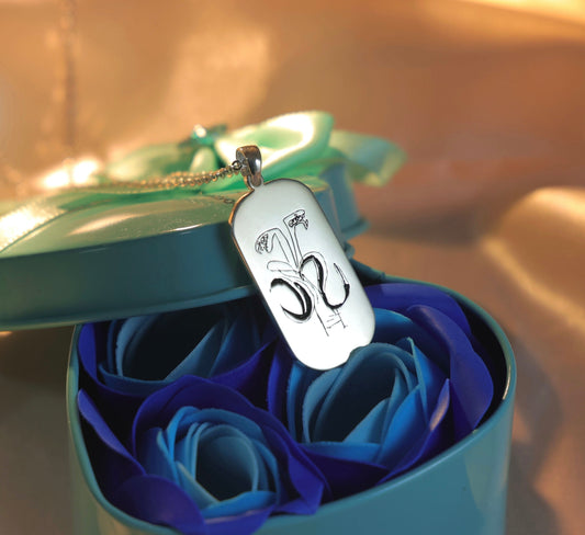 Silver dog tag necklace engraved with artwork — handcrafted personalized pendant.