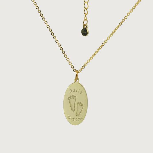 Oval Dario Necklace in gold plated with engraved baby footprints, name, and birthdate – custom keepsake jewelry by Chapters of Joy.