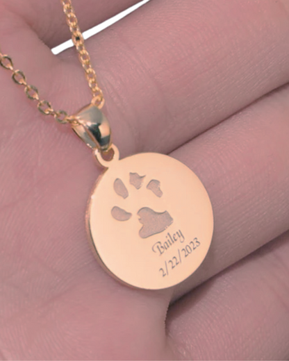 The Bailey Necklace engraved with custom dog paw print and name in rose gold plated necklace.