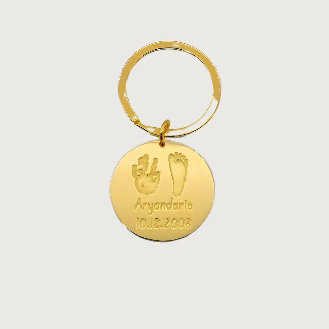Gold Plated Sterling silver round Tina Tag engraved with a child’s handprint and footprint, name, and birthdate 