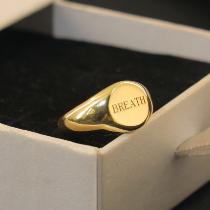 Gold plated Verse Signet Ring engraved with the word LOVE, symbolizing hope, faith, and inspiration.