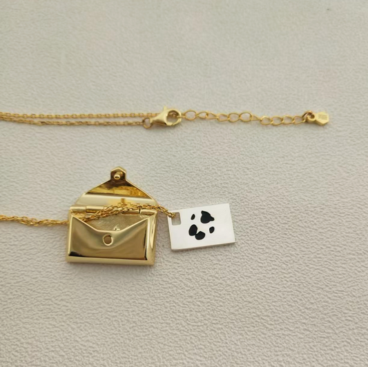 Lunelle envelope locket with paw print engraving inside