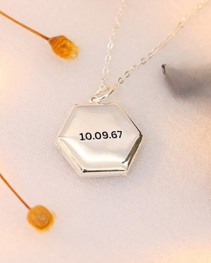 Silver Maelle honeycomb locket necklace with custom date engraving on the front, personalized memory locket.
