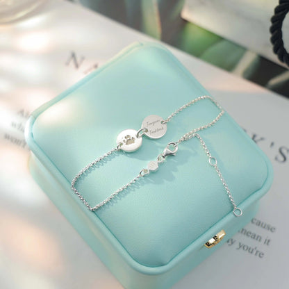 Sterling silver bracelet engraved with pet paw print and name — custom keepsake jewelry from Chapters of Joy.