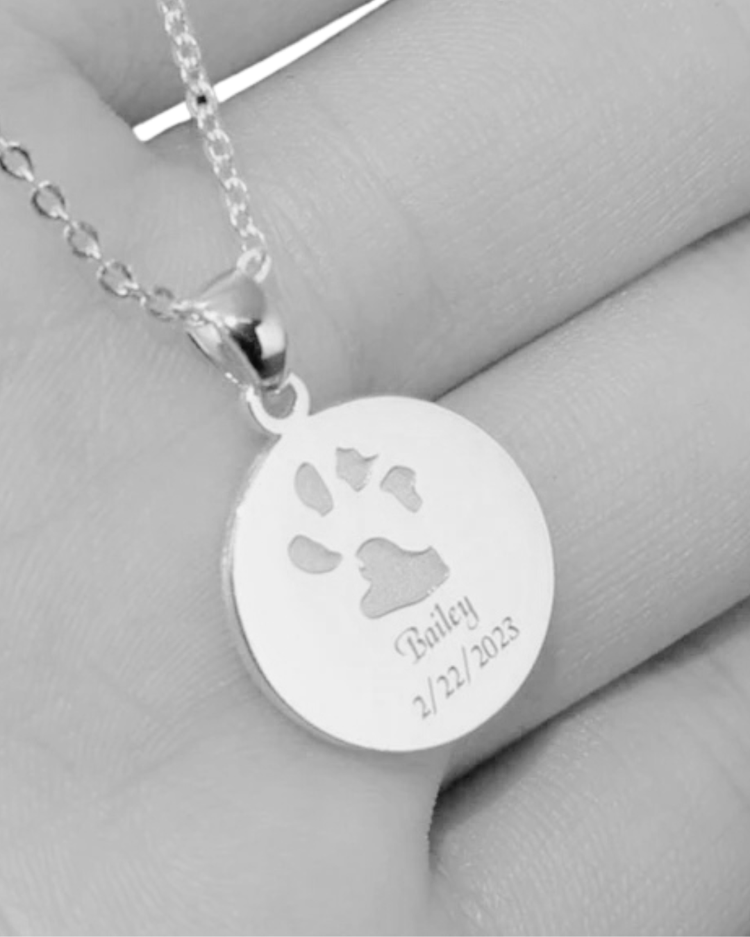 Sterling silver pendant necklace engraved with a pet’s paw print and name — custom  jewelry from Chapters of Joy.