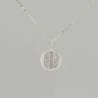 Custom engraved pendant with fingerprints and ‘Together as one’ inscription