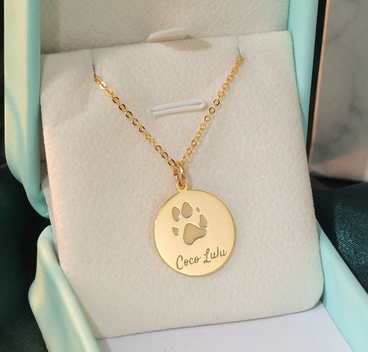 The Coco Necklace engraved with custom dog paw and name print in gold plated.