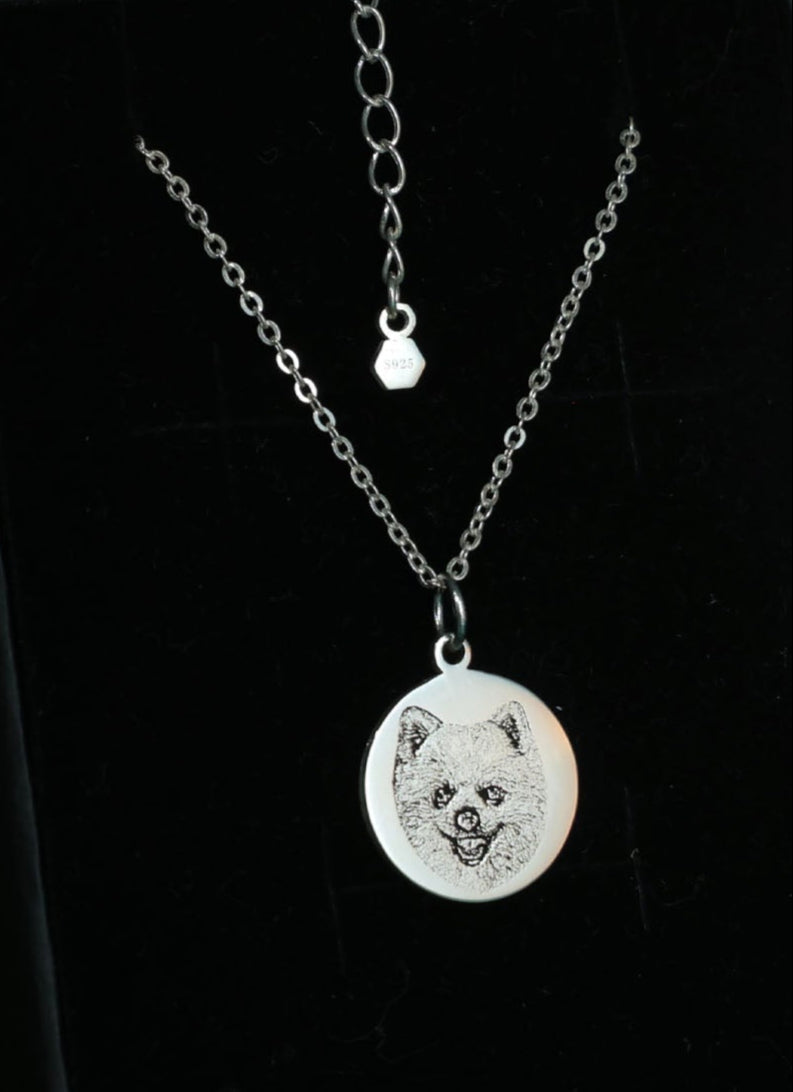 Custom engraved pendant with dog portrait and paw print