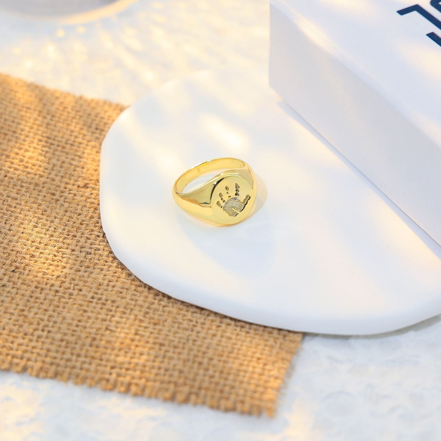 Gold plated signet ring engraved with a loved one’s handprint. Custom signet ring with handprint – unique keepsake gift