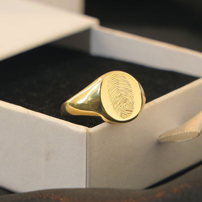 Layla Signet Ring in gold with fingerprint engraving on band.