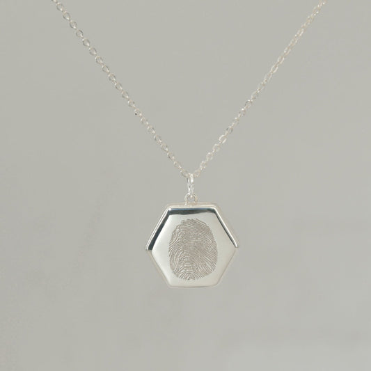 Sterling silver Lina Locket with fingerprint engraving, handwritten message, and UV-lasered photograph inside.