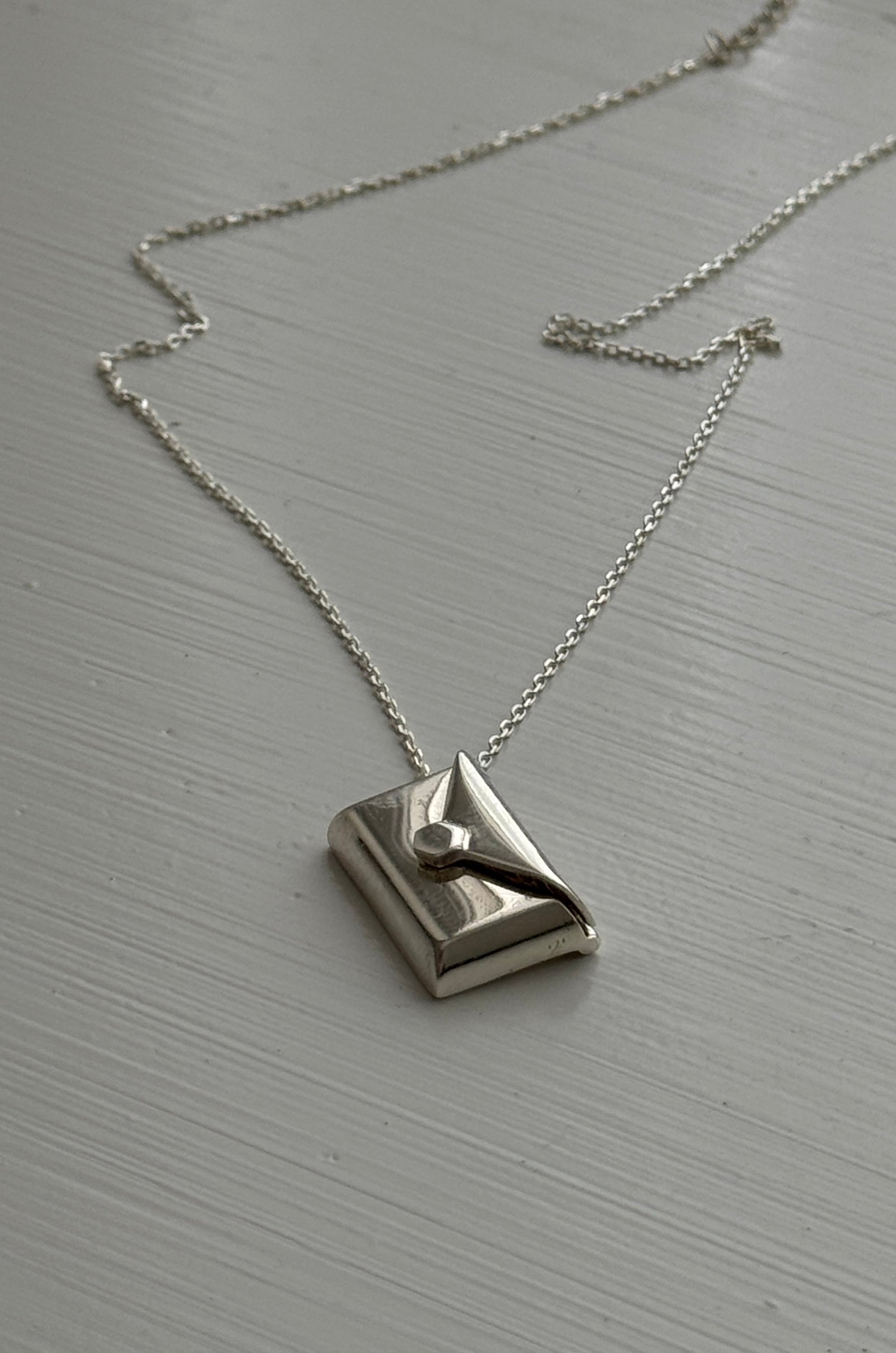 Lunelle necklace in sterling silver with hidden letter pendant