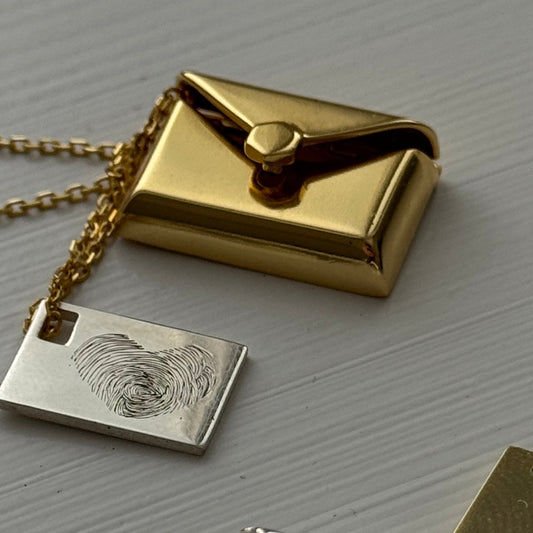 Maelle envelope necklace with hidden letter charm, engraved with personalized message, handwriting, paw print, or fingerprint.