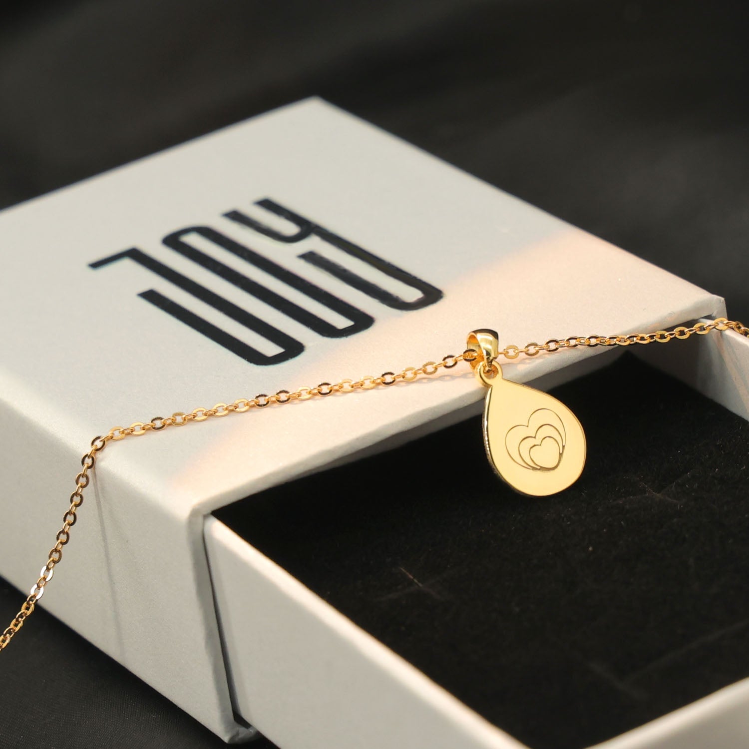 Personalized engraved heart pendant with custom message