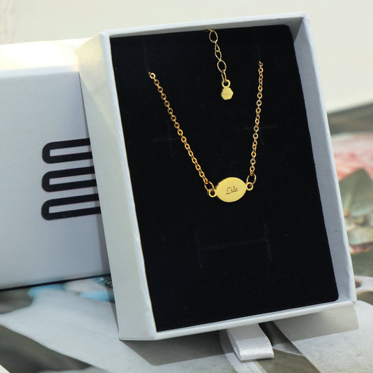 Roxy oval bracelet in sterling silver 18k gold plated with engraving names on both sides.