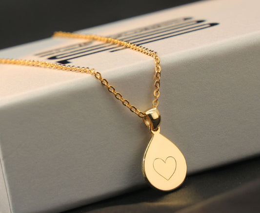 Custom drop shape, gold plated pendant engraved with a heart shape