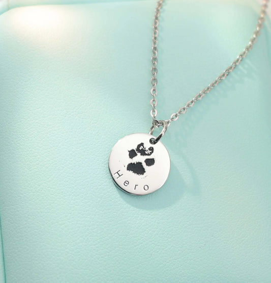 White gold–plated silver pendant engraved with a custom paw or nose print, personalized pet keepsake necklace.